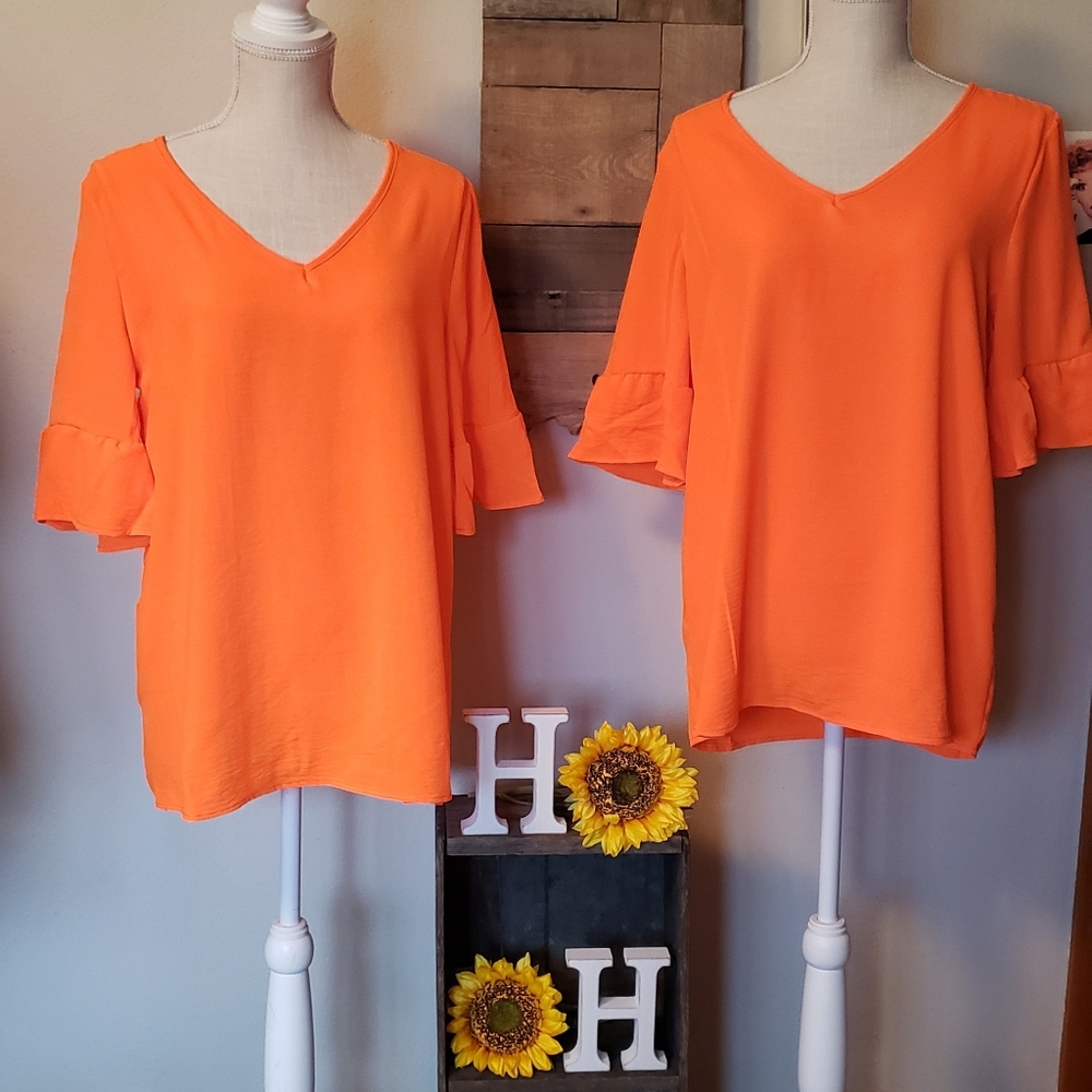 Neon coral ruffle sleeve top.